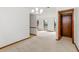 Open-concept living area with neutral walls, carpet and natural light from the window at 8988 Angelica Dr, Orlando, FL 32836