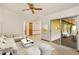 Inviting living room featuring a comfortable sofa, stylish coffee table, and sliding glass doors at 8988 Angelica Dr, Orlando, FL 32836