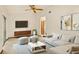 Cozy living room with a modern sectional sofa, stylish coffee table, and accent furniture at 8988 Angelica Dr, Orlando, FL 32836