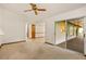 Inviting living room with a modern sectional sofa, stylish coffee table, and sliding glass doors at 8988 Angelica Dr, Orlando, FL 32836