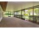 Screened patio showcasing outdoor furniture, overlooking the meticulously landscaped backyard at 8988 Angelica Dr, Orlando, FL 32836