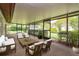 Screened patio showcasing outdoor furniture, overlooking the meticulously landscaped backyard at 8988 Angelica Dr, Orlando, FL 32836