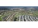 Aerial view of Primary planned community, golf course, and residential homes at 9014 Stinger Dr, Davenport, FL 33896