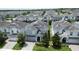 Aerial view of the blue home in a community, showcasing its neighborhood setting at 9014 Stinger Dr, Davenport, FL 33896