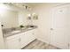 Bathroom features a double sink vanity with granite countertops and neutral tile flooring at 9014 Stinger Dr, Davenport, FL 33896
