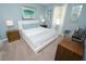 Cozy bedroom featuring a queen-size bed, soft lighting, and matching nightstands at 9014 Stinger Dr, Davenport, FL 33896