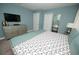 Relaxing bedroom features a TV, dresser, and closet for storage, creating a comfortable retreat at 9014 Stinger Dr, Davenport, FL 33896