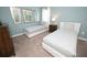Well-appointed bedroom with two twin beds, stylish decor, and ambient lighting at 9014 Stinger Dr, Davenport, FL 33896