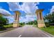 Community entrance featuring the Champions Gate sign, symbolizing exclusivity at 9014 Stinger Dr, Davenport, FL 33896