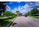 Entrance to the community with well-manicured landscaping and welcoming signage at 9014 Stinger Dr, Davenport, FL 33896