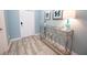 Light and welcoming entryway with a decorative console table and stylish tile flooring at 9014 Stinger Dr, Davenport, FL 33896