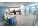 A kitchen with modern stainless steel appliances, granite countertops, and tile flooring at 9014 Stinger Dr, Davenport, FL 33896