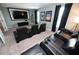 Home theater boasts comfortable reclining chairs, large screen, and theater decor at 9014 Stinger Dr, Davenport, FL 33896