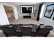 Comfortable media room featuring leather reclining seats and a large screen at 9014 Stinger Dr, Davenport, FL 33896
