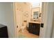 Bathroom features a modern vanity, a tile floor, and a shower and tub at 9257 Outlook Rock Trl, Windermere, FL 34786