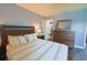 Bedroom showcasing a wood bed frame, a ceiling fan, and a wood floor at 9257 Outlook Rock Trl, Windermere, FL 34786