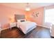 Bedroom featuring a velvet headboard, modern chandelier and nice-looking flooring at 9257 Outlook Rock Trl, Windermere, FL 34786