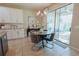 Cozy breakfast nook with modern lighting and access to outdoor patio at 9257 Outlook Rock Trl, Windermere, FL 34786
