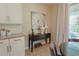 Breakfast nook with table, art and patio access at 9257 Outlook Rock Trl, Windermere, FL 34786