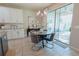Cozy breakfast nook with modern lighting and access to outdoor patio at 9257 Outlook Rock Trl, Windermere, FL 34786