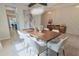 Elegant dining room featuring a modern chandelier and stylish accent wall at 9257 Outlook Rock Trl, Windermere, FL 34786