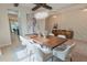 Elegant dining room featuring a modern chandelier and stylish accent wall at 9257 Outlook Rock Trl, Windermere, FL 34786