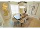 Dining room features large table, decorative lighting, and stylish decor at 9257 Outlook Rock Trl, Windermere, FL 34786