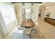 Bright dining room with modern chandelier, decorative art, and a neutral-colored rug at 9257 Outlook Rock Trl, Windermere, FL 34786