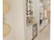 This kitchen boasts custom wine storage, granite countertops, stainless steel appliances, and a beverage refrigerator at 9257 Outlook Rock Trl, Windermere, FL 34786