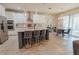 Bright, open kitchen with a granite island, stainless steel appliances, pendant lighting, and a breakfast nook at 9257 Outlook Rock Trl, Windermere, FL 34786