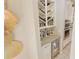 Kitchen features custom wine storage, granite countertops, stainless steel appliances, and a beverage refrigerator at 9257 Outlook Rock Trl, Windermere, FL 34786