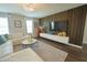 Elegant living room with wood accent wall and recessed lighting at 9257 Outlook Rock Trl, Windermere, FL 34786