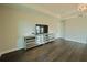 Staged sitting area featuring dark wood floors and mirrored cabinets at 9257 Outlook Rock Trl, Windermere, FL 34786