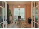 Office space with modern desk and large window offering natural light at 9257 Outlook Rock Trl, Windermere, FL 34786