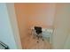 Small office space features a desk and chair at 9257 Outlook Rock Trl, Windermere, FL 34786