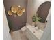 Stylish powder room showcasing modern fixtures, a vessel sink, and decorative gold accents at 9257 Outlook Rock Trl, Windermere, FL 34786