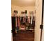 Organized walk-in closet with shelves and racks for ample storage at 9257 Outlook Rock Trl, Windermere, FL 34786
