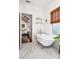 Bathroom with clawfoot tub next to window, view into the main bedroom at 1008 Delaney Park Dr, Orlando, FL 32806