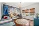 Charming bedroom featuring unique mural, chandelier, and windows, creating a whimsical retreat at 1008 Delaney Park Dr, Orlando, FL 32806