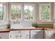 Sunlit kitchen with a farmhouse sink and butcher block countertops at 1008 Delaney Park Dr, Orlando, FL 32806