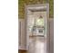 Quaint kitchen with classic appliances, hardwood floors, a window view, and vintage charm at 1008 Delaney Park Dr, Orlando, FL 32806