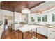 Kitchen with an island and a door leading to the dining room at 1008 Delaney Park Dr, Orlando, FL 32806