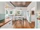 Bright kitchen with wood ceiling, white cabinets, and a marble island that offers both style and functionality at 1008 Delaney Park Dr, Orlando, FL 32806