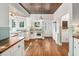 Quaint kitchen with hardwood floors, custom cabinets, butcher block countertops and vintage appliances at 1008 Delaney Park Dr, Orlando, FL 32806