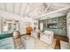 Spacious living room with vaulted ceilings, hardwood floors, fireplace, and built-in bookshelves at 1008 Delaney Park Dr, Orlando, FL 32806