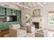 Spacious living room featuring a fireplace, built-in bookcase, with chairs and bright, natural light at 1008 Delaney Park Dr, Orlando, FL 32806