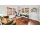 Bright living space with hardwood floors, work area, and windows providing beautiful natural light at 1008 Delaney Park Dr, Orlando, FL 32806