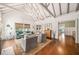Open living room with vaulted ceilings, comfortable seating, fireplace, and hardwood floors at 1008 Delaney Park Dr, Orlando, FL 32806
