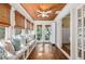 Cozy sun room with hardwood ceiling, white trim, and built-in bench seating, filled with natural light at 1008 Delaney Park Dr, Orlando, FL 32806