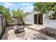 Charming backyard with a patio, fire pit, and view of the home's exterior at 103 Gleason Cv, Sanford, FL 32773